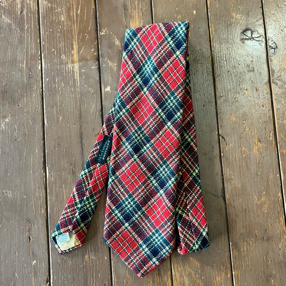 Richman Brothers men's tie features a classic red and green tartan plaid pattern